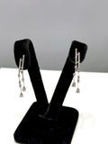 Aretes largos de diamante